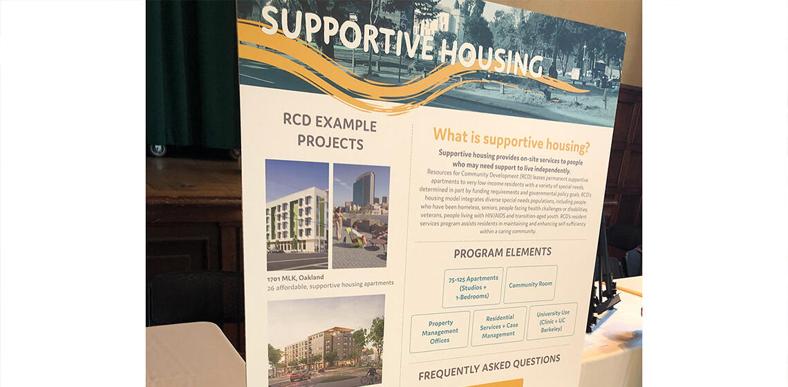 Information board at community open house about supportive housing